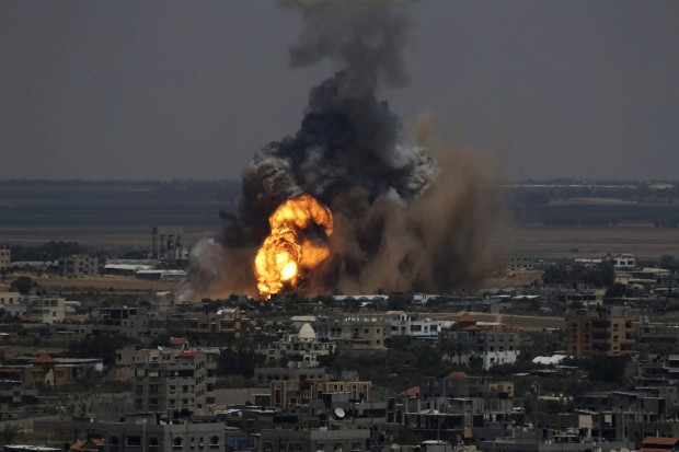 Smoke and flames are seen following what police said was an Israeli air strike in Rafah in Gaza Strip