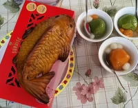 Đưa ông Táo bằng cá chép… bánh