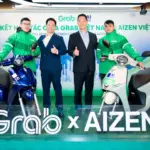 Grab Việt Nam hợp tác với AIZEN Việt Nam hỗ trợ đối tác tài xế Grab thuê xe máy điện